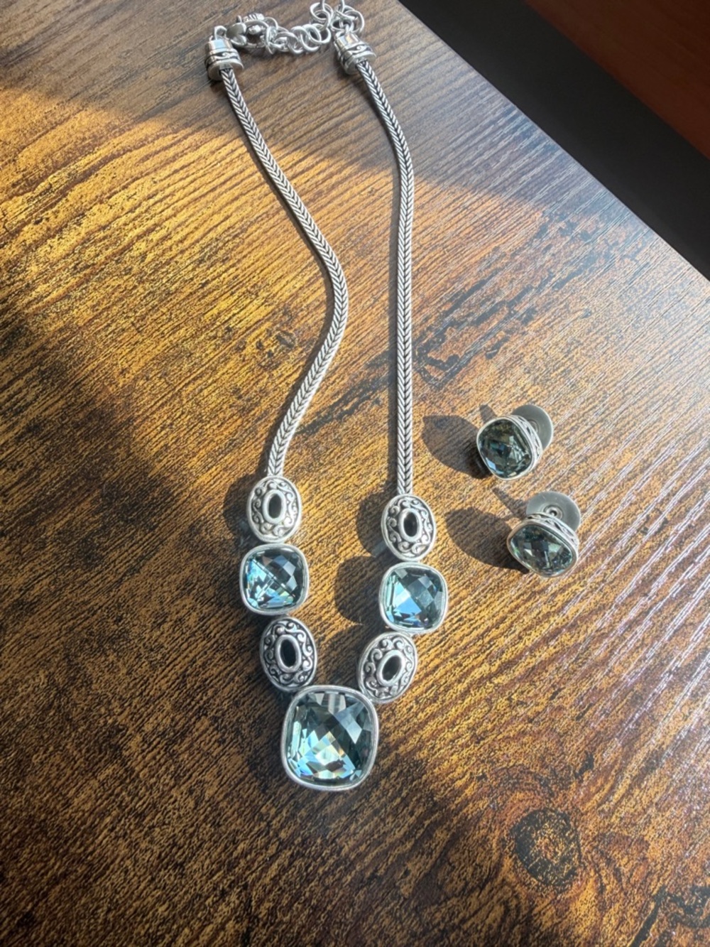 Brighton Venus Rising set silver-tone necklace and earrings with blue crystals.
